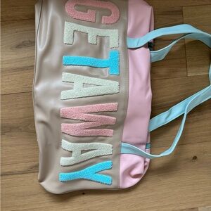 Jadelynn Brooke Pink and Tan Travel Bag with Bold GETAWAY Design